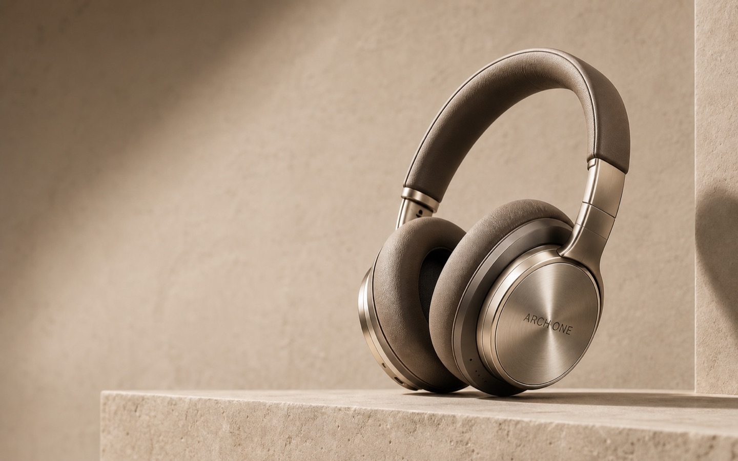 Arch One wireless headphones in champagne aluminum and taupe leather